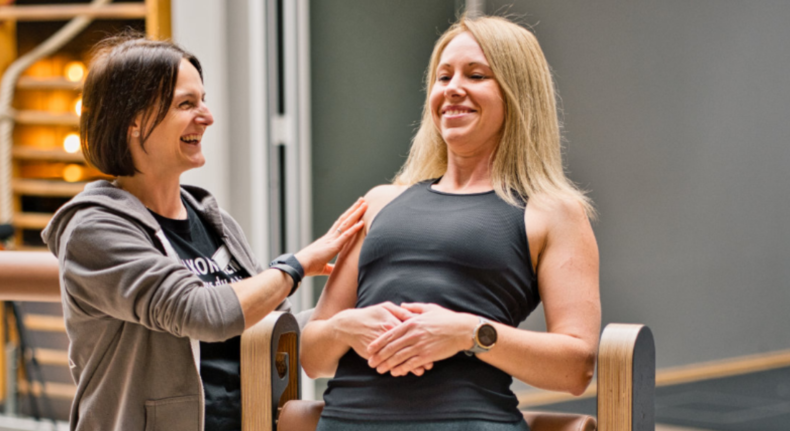 Professional athlete performing dynamic fascia stretches in a bright studio