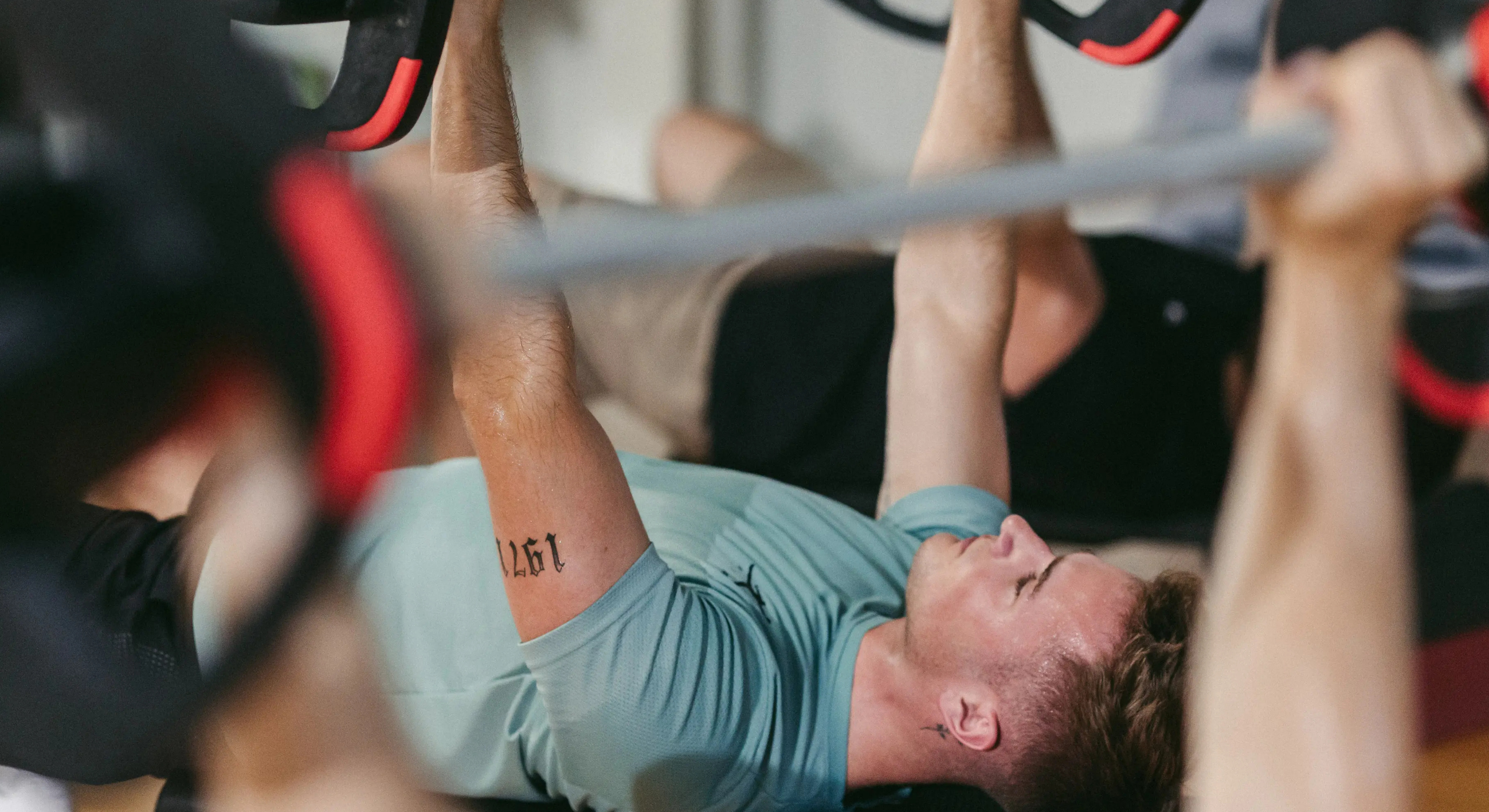 Fitness coach demonstrating functional movement patterns with kettlebells