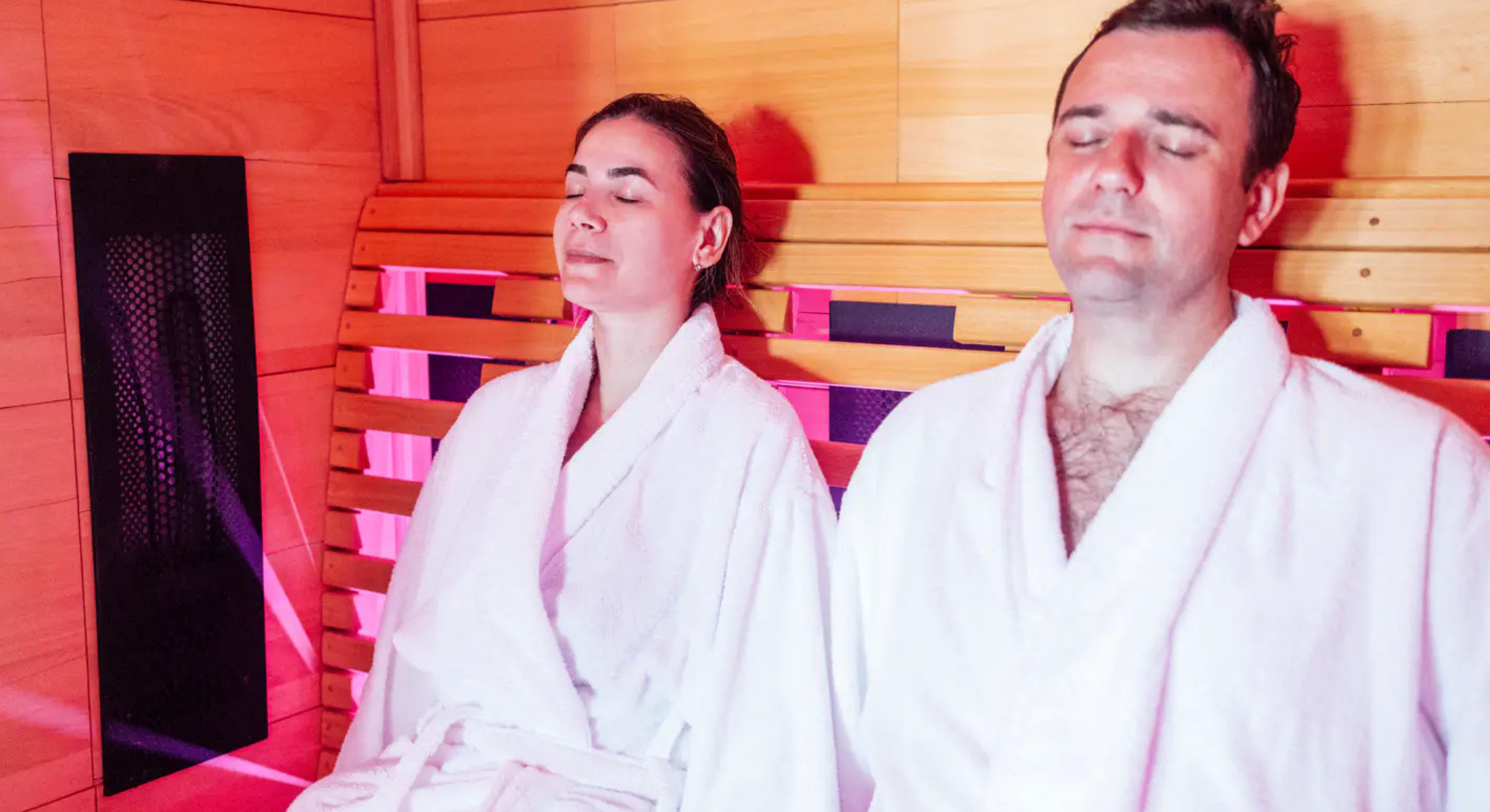 High-tech infrared recovery pod and massage therapy bed in a modern wellness center